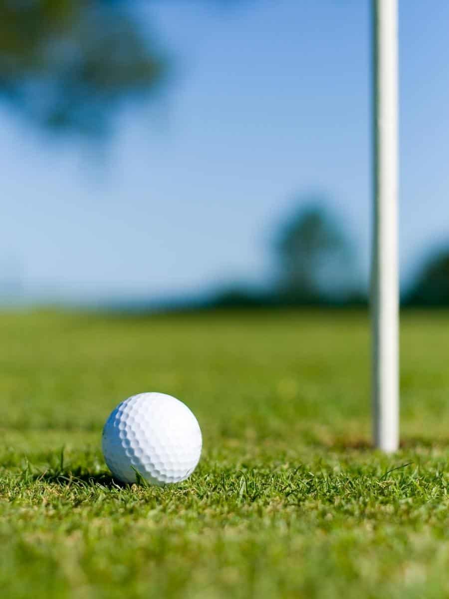 Golf Ball Near The Pin