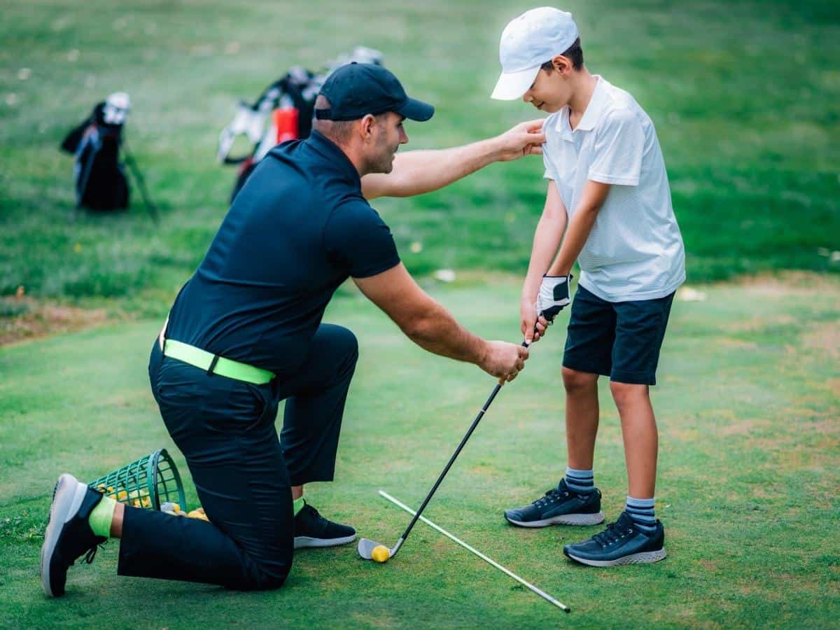 A Child Learning Golf