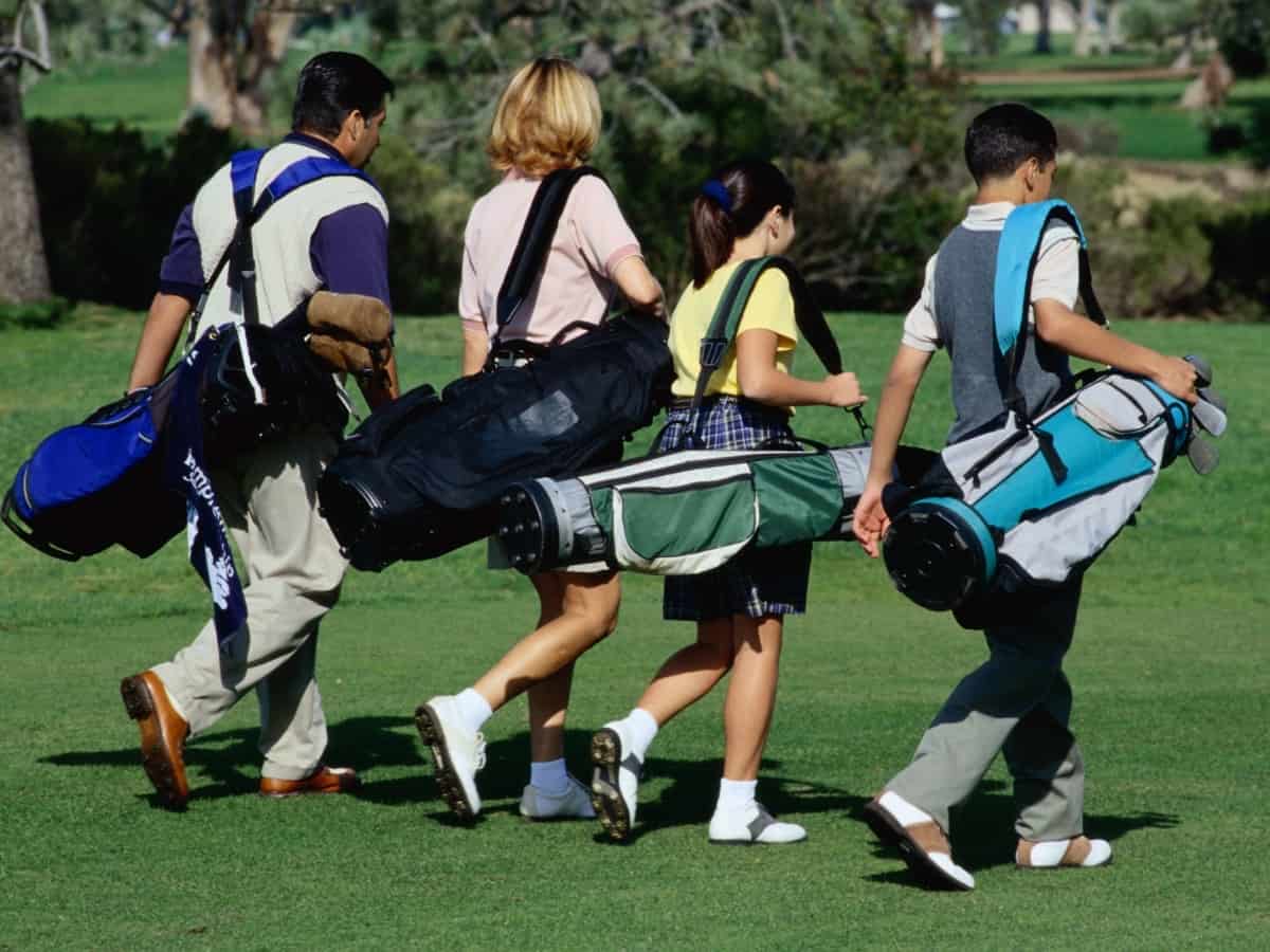 Golfers Carrying Bags